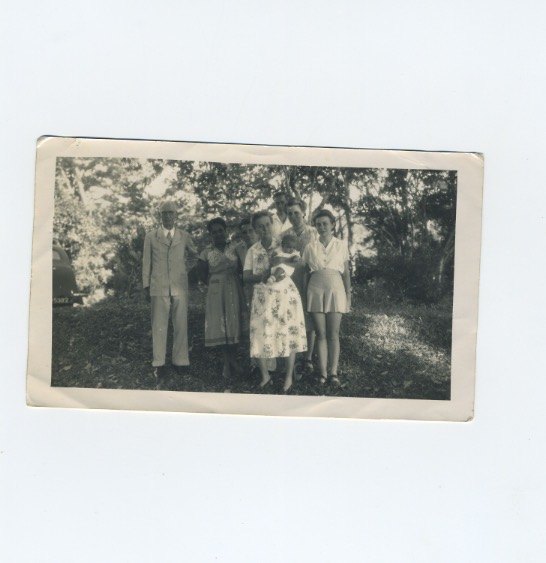 Family group under the trees, with a baby